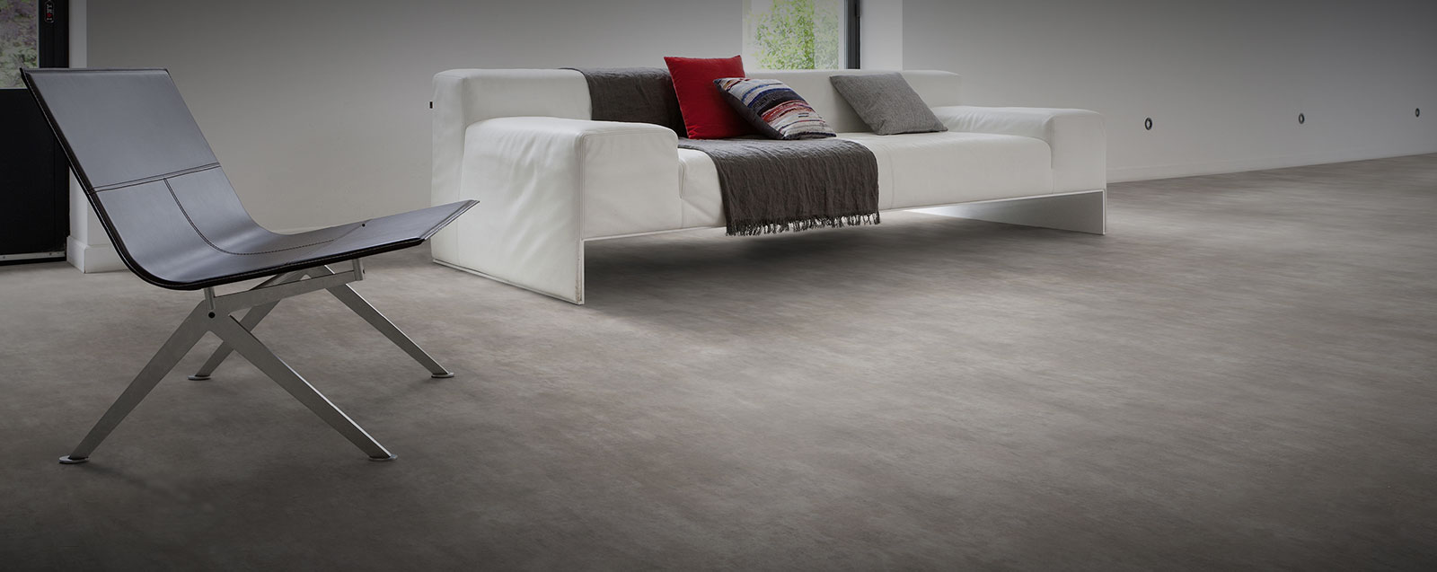 Polished concrete style cushion backed vinyl sheet flooring by Gerfloor